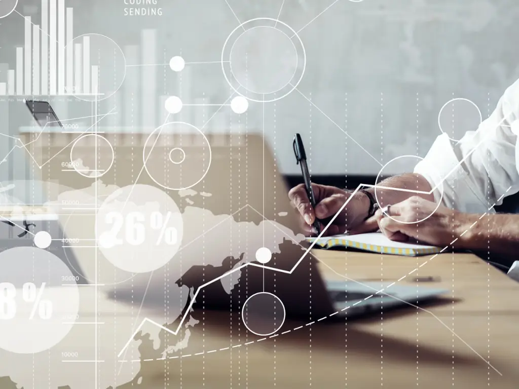 Person analyzing data on laptop with graphs.